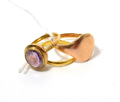 Lot 144 - A 22ct gold band ring finger size O, a signet ring, finger size Q and a 9ct gold amethyst ring,...