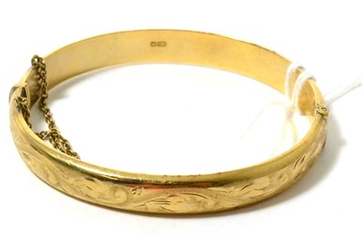 Lot 145 - A 9ct gold bangle