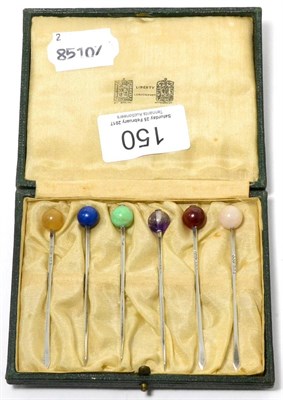 Lot 150 - A set of six silver and hardstone cocktail sticks, retailed by Liberty & Co, cased