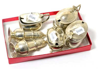 Lot 152 - Four silver mustard pots and a pair of pepperettes
