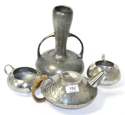 Lot 182 - Three piece tea service designed by Archibald Knox and a pewter vase