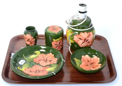 Lot 200 - Five pieces of Moorcroft consisting of a table lamp, jar and cover, small vase, bowl and a...