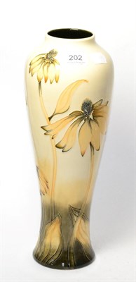 Lot 202 - A Moorcroft vase designed by Anji Davenport, 2001, in the Coneflower pattern with painted and...