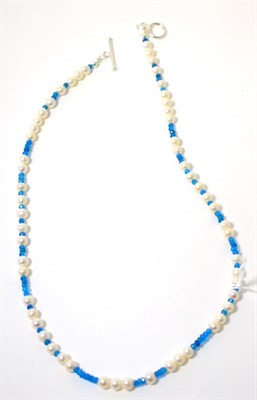 Lot 277 - A cultured pearl and apatite bead necklace and earring suite, round cultured pearls spaced by...