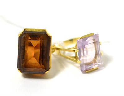 Lot 282 - A citrine ring, finger size L1/2 and a rose quartz ring, finger size L (2)