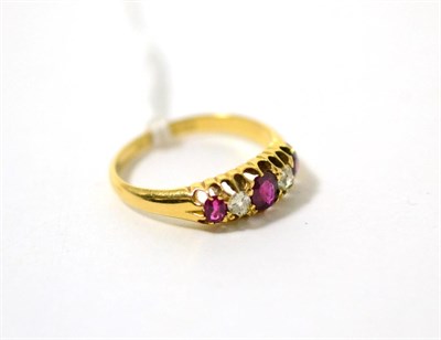 Lot 296 - An 18ct gold ruby and diamond ring, total estimated diamond weight 0.20 carat approximately, finger