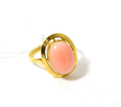 Lot 309 - A coral ring, finger size P