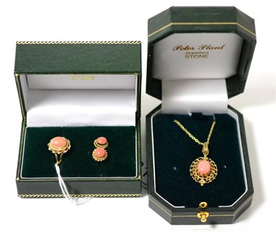 Lot 311 - A 9ct gold coral set pendant on chain and a 9ct gold ring, finger size M and a pair of matching...