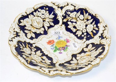 Lot 323 - A 20th century Meissen bowl, relief moulded with painted floral vignette and gilt highlights