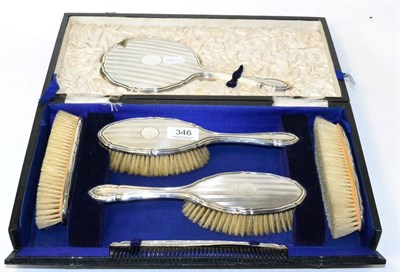 Lot 346 - A silver five piece dressing table set, in fitted case