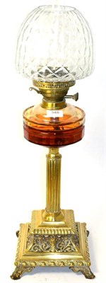 Lot 348 - A Victorian brass column oil lamp with amber glass reservoir and clear glass shade