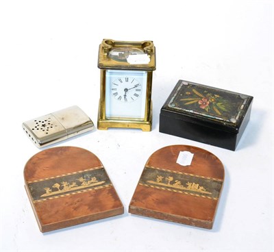 Lot 366 - A brass carriage clock, papier mache box and a pair of bookends