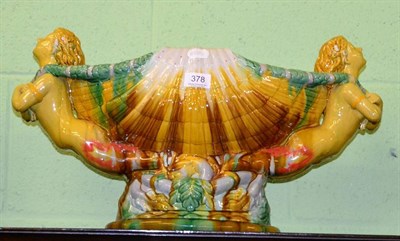 Lot 378 - A majolica shell shaped pedestal vase with figural handles