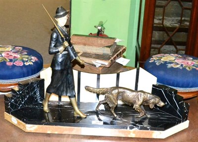 Lot 384 - An Art Deco spelter figure of girl shooting with dog, 45cm