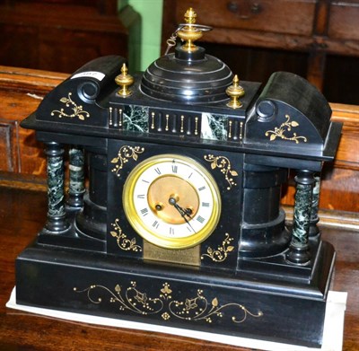 Lot 387 - A black slate and marble striking mantel clock