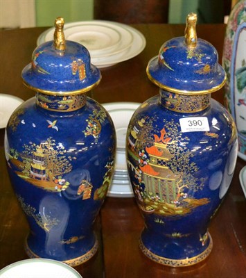 Lot 390 - A pair of Carlton Ware lustre vases and covers in the Oriental pattern