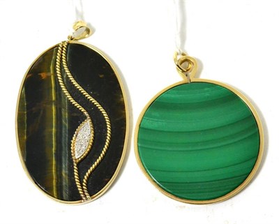 Lot 414 - A Malachite pendant in a 9ct gold frame, and a tiger's eye and diamond pendant (2)