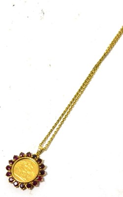 Lot 419 - A Victorian 1893 sovereign loose mount in a 9ct gold garnet set frame as a pendant on chain