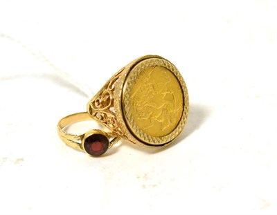 Lot 424 - A 1906 gold sovereign loose mounted as a ring and a garnet ring