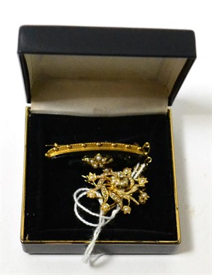 Lot 425 - A seed pearl and diamond brooch/pendant and an onyx and pearl mourning brooch