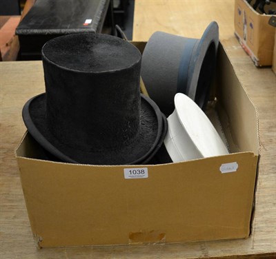 Lot 1038 - A group of hats including two bowlers and two top hats etc