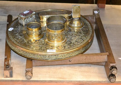 Lot 1047 - An Eastern brass top folding table, a stand, an ashtray, a matchbox holder, two bowls and a box