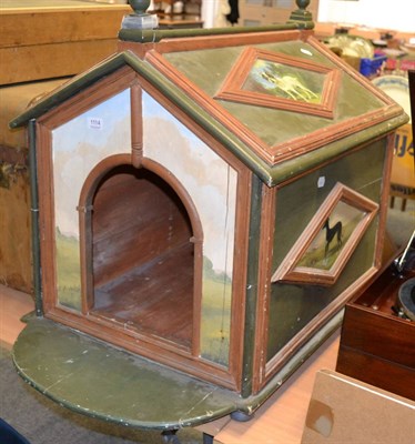 Lot 1114 - A painted wood dog house