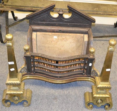 Lot 1120 - A brass and cast iron fire insert in the architectural taste