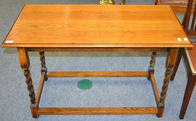 Lot 1125 - An 1920's/30's oak barley twist table