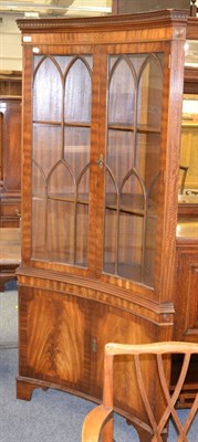 Lot 1131 - A reproduction mahogany inverted bow fronted standing corner cupboard