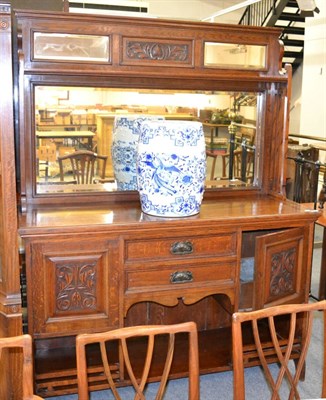 Lot 1133 - An early 20th century oak mirror backed sideboard in the Arts & Crafts taste