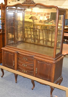 Lot 1134 - A glazed shop display counter with mirrored back, raised on stand