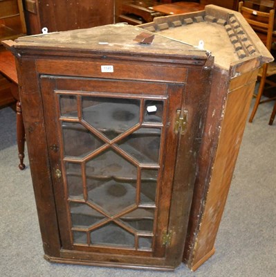 Lot 1145 - A George III oak astragal glazed hanging corner cupboard