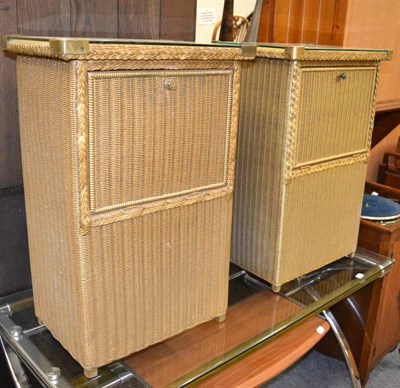 Lot 1148 - A pair of Lloyd loom bedsides with paper labels