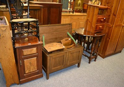 Lot 1154 - A mahogany and walnut pot cupboard, an oak stool, oak magazine rack, oak blanket box, and a...