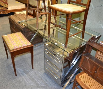 Lot 1159 - A modern chrome and glass desk and matching chest of drawers