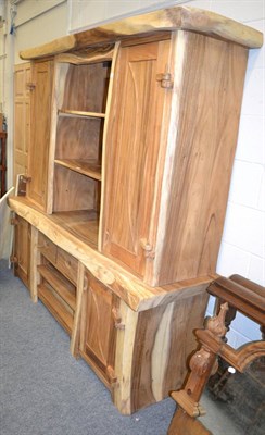 Lot 1160 - A modern naturalistic fruitwood unit, the upper section with recesses and cupboards above a similar