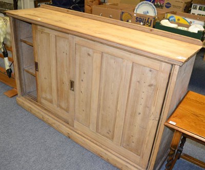 Lot 1173 - Early 20th century pine pantry cupboard with sliding doors