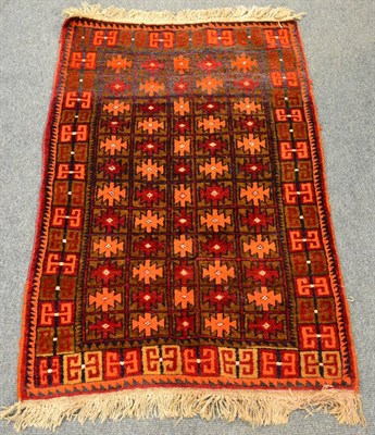 Lot 1223 - A Baluchistan rug, South West Afghanistan, the field with columns of stepped guls enclosed by...