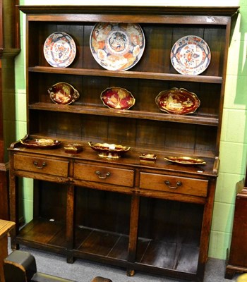 Lot 1228 - An oak dresser and rack