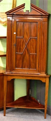 Lot 1232 - A George III corner cupboard on stand