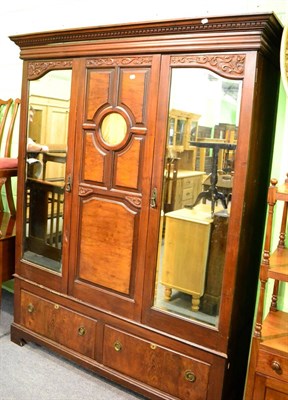 Lot 1235 - A walnut double wardrobe