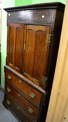 Lot 1238 - A Georgian oak linen press of small proportions