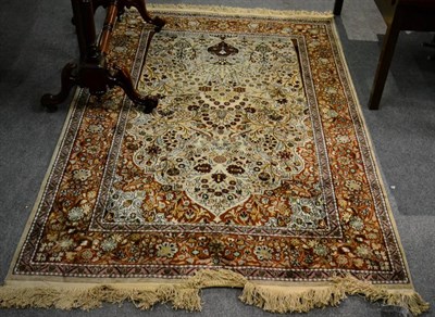 Lot 1249 - Kashmir silk piled rug, North West India, the cream ground centred by an urn issuing flowers...