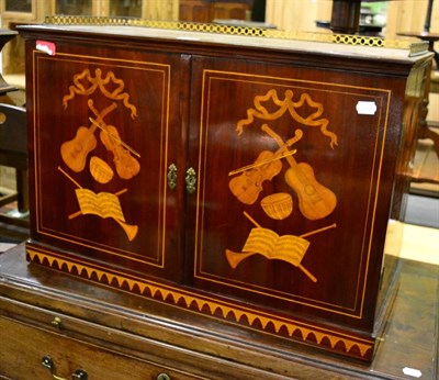 Lot 1258 - An Edwardian satinwood inlaid mahogany music cabinet, the gallery top and doors decorated with...