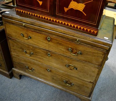 Lot 1259 - A George III mahogany chest with later pine top