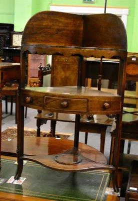 Lot 1279 - A George III oak corner washstand