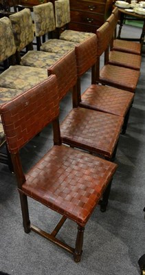 Lot 1305 - A set of six oak and red leather dining chairs