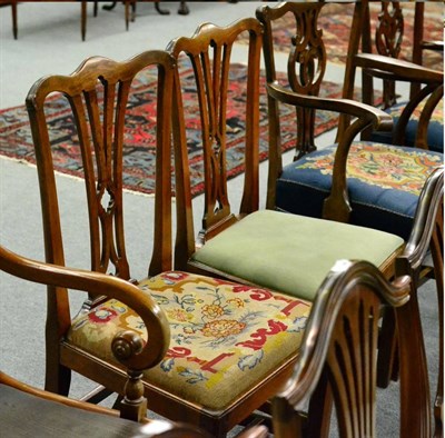 Lot 1319 - A pair of George III oak dining chairs each with drop in seat