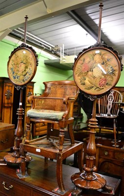 Lot 1328 - A pair of 19th century mahogany grain stained needlework pole screens